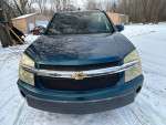 Front view of a 2007 Chevrolet Equinox LT FWD parked in snow, showcasing its clean condition and Chevy branding.