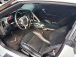 Interior view of a 2014 Chevrolet Corvette featuring leather seats and advanced dashboard controls