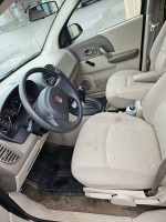 Interior view of a 2003 Saturn VUE SUV, showcasing clean seats, dashboard, and controls.