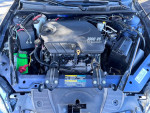 2008 Chevrolet Impala engine compartment showcasing the 3900 V6 flex fuel engine in excellent condition.