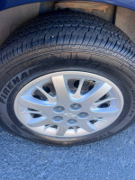 Close-up of the tire and wheel of a 2008 Chevrolet Impala with low mileage and excellent condition.
