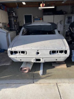 Rear view of a stripped 1967 Chevrolet Camaro RS Coupe ready for restoration and body work.