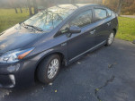 2013 Toyota Prius Plug-in Hybrid with 106,000 miles, clean condition and great tires, ideal for eco-friendly commuting.