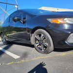2015 Honda Civic EX in black with automatic transmission, parked on asphalt, side view showcasing alloy wheels.