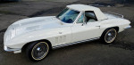 1965 Chevrolet Corvette Stingray Convertible in white with leather interior, displaying classic design and style.