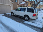 2004 Lincoln Aviator Luxury AWD parked in snow-covered driveway with elegant white exterior