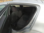 Interior view of a 2012 Chevrolet Sonic LT with clean seats and ample space, showcasing low mileage condition.