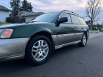 2002 Subaru Legacy Outback with low mileage, clean interior, fully equipped, parked on the street