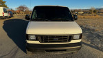 Front view of a 2007 Ford E-350 van, ideal for weekend adventures with motocross or biking gear.