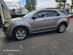 2012 Chevrolet Equinox LT AWD in gray color parked, showcasing clean design and alloy wheels.