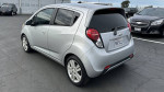 2013 Chevrolet Spark with 124,000 miles, featuring automatic transmission and touchscreen radio.