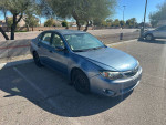 2008 Subaru Impreza WRX in blue, showing mechanic's special condition, parked with clear background.