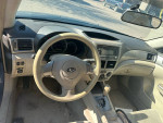 Interior view of a 2008 Subaru Impreza WRX showing steering wheel and dashboard controls.