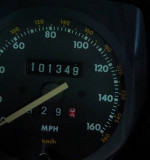 Dashboard of a 1989 Jaguar XJS showing mileage of 101,349 miles, project car needs repairs.