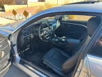Interior view of a 2015 BMW 435i, featuring black leather seats and advanced technology options.