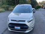 2014 Ford Transit Connect XLT with 90,000 miles, fully loaded, parked in a scenic location