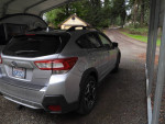 2019 Subaru Crosstrek in gray color parked under a cover, showcasing its design and condition.