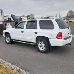1999 Dodge Durango in white, well maintained with 57,000 miles, featuring a clean interior and roof rack.