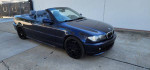 Black BMW 330i Convertible with new rims, low miles, and clean title, parked on a concrete surface.