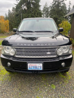 Front view of a 2006 Land Rover Range Rover in black with clear title and new features
