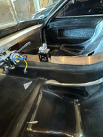 Interior view of a custom Ford GT, showcasing carbon fiber details and racing components.