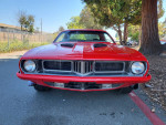 Front view of a red 1974 Plymouth Cuda with clean title and leather interior.
