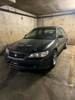 1998 Honda Accord LX parked in a garage, showcasing new battery and carbon fiber hood.