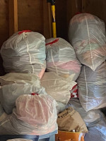 Several trash bags of brand name clothes