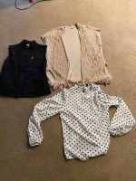 Several trash bags of brand name clothes